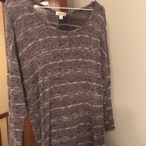 Light striped sweater with buttons on back.